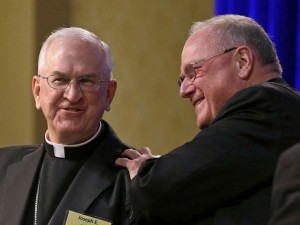 Archbishop Joseph Kurtz, left of Louisville, Ky., was elected president of the U.S. Conference of Catholic Bishops on Tuesday, Nov. 12, in Baltimore, Md. Here he is seen with the outgoing president New York Cardinal Timothy Dolan. Associated Press
